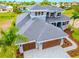 Luxury home with tile roof, two-car garage, and landscaped yard at 6434 Rubia Cir, Apollo Beach, FL 33572