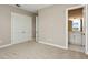 Well-lit bedroom with plush carpeting and en-suite bathroom at 6434 Rubia Cir, Apollo Beach, FL 33572