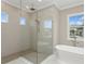 Bathroom with walk-in shower and a free-standing bathtub at 6434 Rubia Cir, Apollo Beach, FL 33572