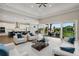 Open living room and kitchen with sliding glass doors to lanai at 6434 Rubia Cir, Apollo Beach, FL 33572
