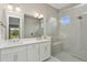 Modern bathroom with double vanity, quartz countertop, and large walk-in shower at 6434 Rubia Cir, Apollo Beach, FL 33572
