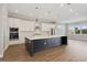 Modern kitchen with large island and stainless steel appliances at 6434 Rubia Cir, Apollo Beach, FL 33572