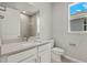 Clean bathroom with single vanity and a shower at 11217 Livewell Ct, Venice, FL 34293