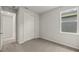 Well-lit bedroom featuring carpet and a closet at 11217 Livewell Ct, Venice, FL 34293