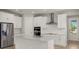 Modern kitchen with stainless steel appliances and light cabinets at 11217 Livewell Ct, Venice, FL 34293