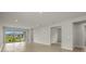 Living room with sliding glass doors leading to the patio at 11217 Livewell Ct, Venice, FL 34293