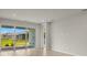 Living room with sliding glass doors leading to the backyard at 11217 Livewell Ct, Venice, FL 34293