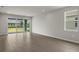 Spacious living area with sliding glass doors and backyard view at 11223 Livewell Ct, Venice, FL 34293