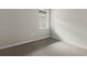 Simple carpeted bedroom with a window and neutral walls at 11223 Livewell Ct, Venice, FL 34293