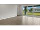 Bright living room with sliding glass doors opening to a patio and grassy backyard at 11223 Livewell Ct, Venice, FL 34293