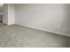Simple bedroom with grey carpet and an exterior view at 11223 Livewell Ct, Venice, FL 34293
