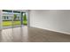 Living room with sliding glass doors leading to backyard patio at 11223 Livewell Ct, Venice, FL 34293