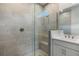 Modern bathroom with a large walk-in shower and a single vanity at 11223 Livewell Ct, Venice, FL 34293
