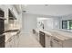 Modern kitchen with stainless steel appliances and white cabinets at 6225 Hidden Branch Dr, Apollo Beach, FL 33572