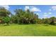 Large backyard with lush green grass at 14350 Allensworth Ave, Port Charlotte, FL 33981