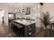 Modern kitchen with large island and stainless steel appliances at Lot 1 Jefferson St, Safety Harbor, FL 34695