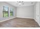 Spacious bedroom with hardwood floors and large windows at 17059 Nokota Ave, Hudson, FL 34667