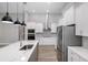 Bright kitchen with white cabinets, stainless steel appliances, and an island at 17059 Nokota Ave, Hudson, FL 34667