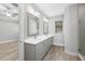 Elegant bathroom with double vanity and walk-in shower at 17059 Nokota Ave, Hudson, FL 34667