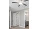 Bright bedroom with ceiling fan and access to a bathroom at 17059 Nokota Ave, Hudson, FL 34667