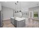 Open concept kitchen and living area with modern finishes at 17059 Nokota Ave, Hudson, FL 34667