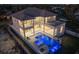 Aerial view of a luxurious home with a modern design, showcasing its pool and balcony at 5032 W Longfellow Ave, Tampa, FL 33629