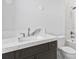Modern bathroom featuring a marble countertop and a glass shower at 5032 W Longfellow Ave, Tampa, FL 33629