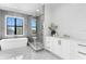 Luxurious bathroom with white cabinets and a glass shower at 5032 W Longfellow Ave, Tampa, FL 33629