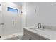 Modern bathroom featuring tile shower, sleek fixtures, and a quartz-topped vanity at 5032 W Longfellow Ave, Tampa, FL 33629