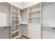 Walk-in closet with custom shelving and drawers for ample storage space at 5032 W Longfellow Ave, Tampa, FL 33629
