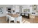 Open concept kitchen with a large island, white cabinets, and stainless steel appliances is perfect for entertaining at 5032 W Longfellow Ave, Tampa, FL 33629