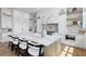 Kitchen island with marble countertop and seating provides space for dining and food preparation at 5032 W Longfellow Ave, Tampa, FL 33629