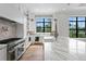 Spacious kitchen with marble countertops, stainless steel appliances, and large windows offers a modern design at 5032 W Longfellow Ave, Tampa, FL 33629