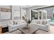 Bright living room showcasing stylish sofas and artwork at 5032 W Longfellow Ave, Tampa, FL 33629