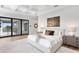 Bright bedroom with a view to the balcony and decorative wall art at 5032 W Longfellow Ave, Tampa, FL 33629