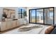 Bedroom featuring light wood floors and sliding glass doors with ocean view at 5032 W Longfellow Ave, Tampa, FL 33629