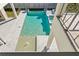 Aerial view of a luxurious pool with a hot tub and wading area at 5032 W Longfellow Ave, Tampa, FL 33629