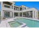 Luxury home featuring a gorgeous pool, spa, and outdoor living space with a modern design at 5032 W Longfellow Ave, Tampa, FL 33629