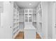 Spacious walk-in closet with custom shelves, hanging rods, and central island at 5032 W Longfellow Ave, Tampa, FL 33629