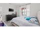 Spacious bedroom with king-size bed, dresser, and plenty of natural light at 6409 Oyster Island Cv, Apollo Beach, FL 33572