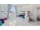 Bedroom with bunk bed, desk, and plenty of natural light at 6409 Oyster Island Cv, Apollo Beach, FL 33572