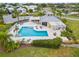 Relaxing community pool area with ample seating and a covered patio at 6409 Oyster Island Cv, Apollo Beach, FL 33572