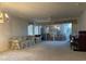 Spacious living room with patio doors and piano at 201 Silver Lake Dr # 101, Venice, FL 34292