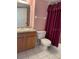 Clean bathroom, featuring a toilet and shower at 201 Silver Lake Dr # 101, Venice, FL 34292