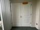 White double doors leading into the condo at 201 Silver Lake Dr # 101, Venice, FL 34292