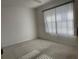 Spacious bedroom with window coverings and carpet at 201 Silver Lake Dr # 101, Venice, FL 34292