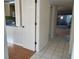 Clean and bright hallway with tile floor at 201 Silver Lake Dr # 101, Venice, FL 34292