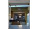 Kitchen with light cabinets and a view into living room at 201 Silver Lake Dr # 101, Venice, FL 34292