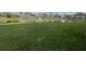 Serene pond view with lush green grass and fountain at 201 Silver Lake Dr # 101, Venice, FL 34292