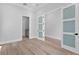 Bedroom featuring neutral walls, a frosted glass door, and access to the bathroom at 3109 W Knights Ave, Tampa, FL 33611